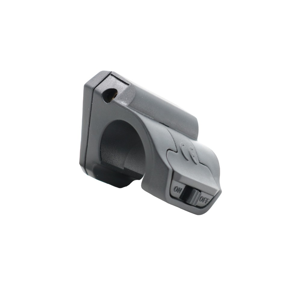 Vista laterale a 3/4 del mirino laser a clip per ANGY, corpo grigio antracite opaco con selettore ON/OFF visibile e aggancio circolare